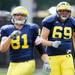 Michigan sophomore offensive lineman Erik Gunderson does a stretching drill during warm ups at practice on Tuesday.  Melanie Maxwell I AnnArbor.com
